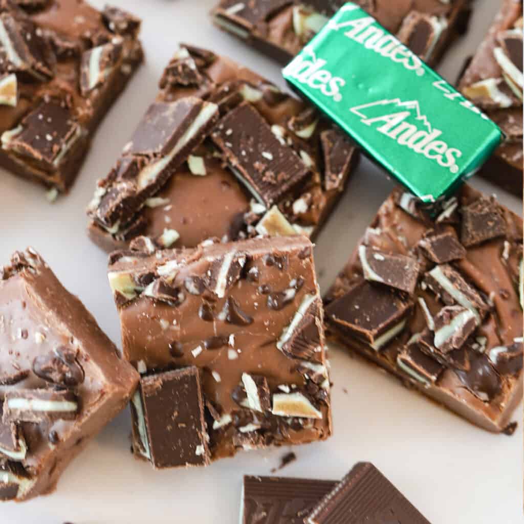 andes mint fudge stacked in a pile with mints around