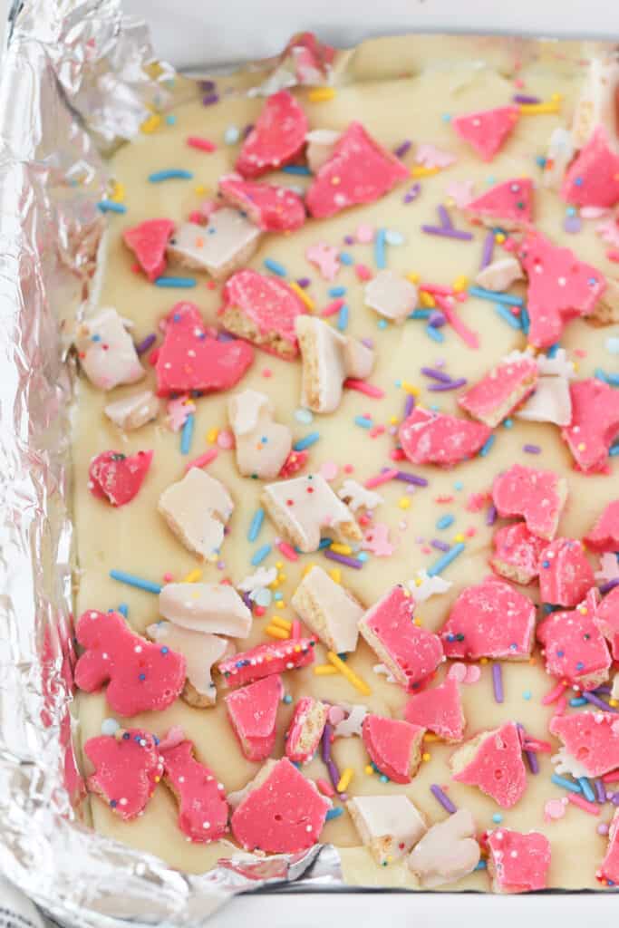 Animal Cookie Fudge in a baking dish lined with foil.