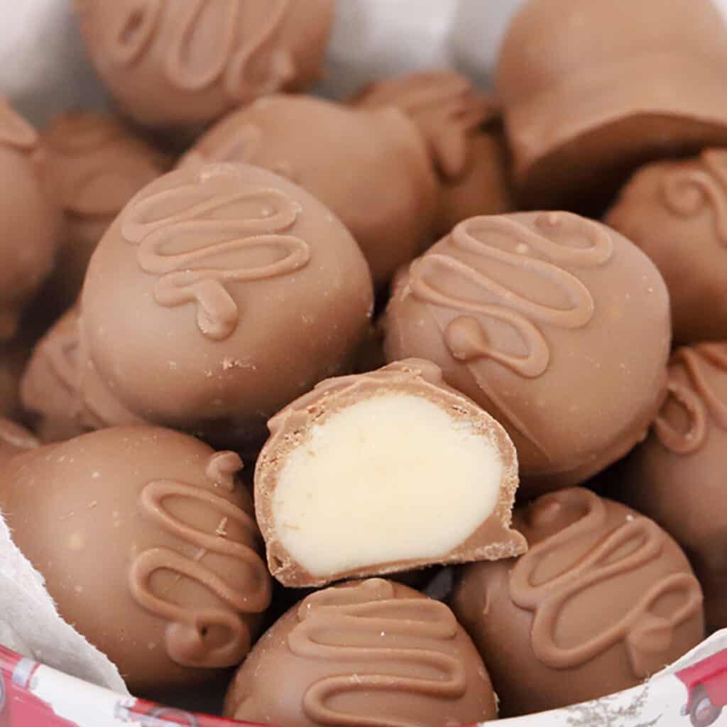 Coconut balls dipped in chocolate.