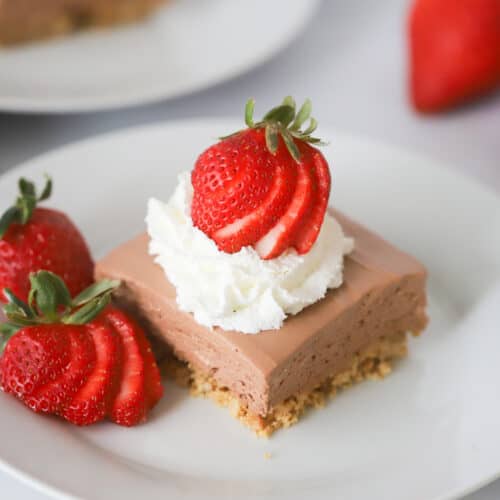 no bake cheesecake bars on a white plate
