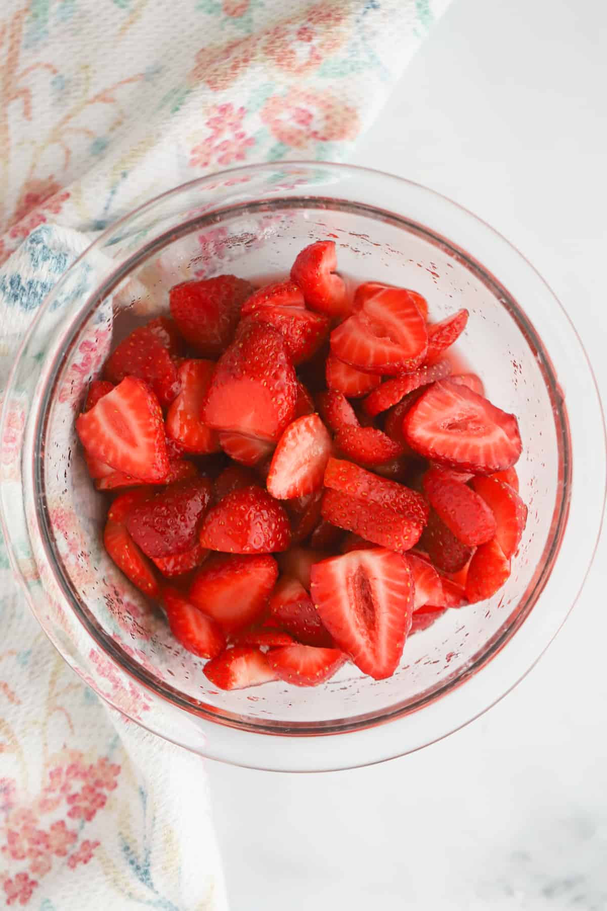 macerated strawberries in a small glass dish