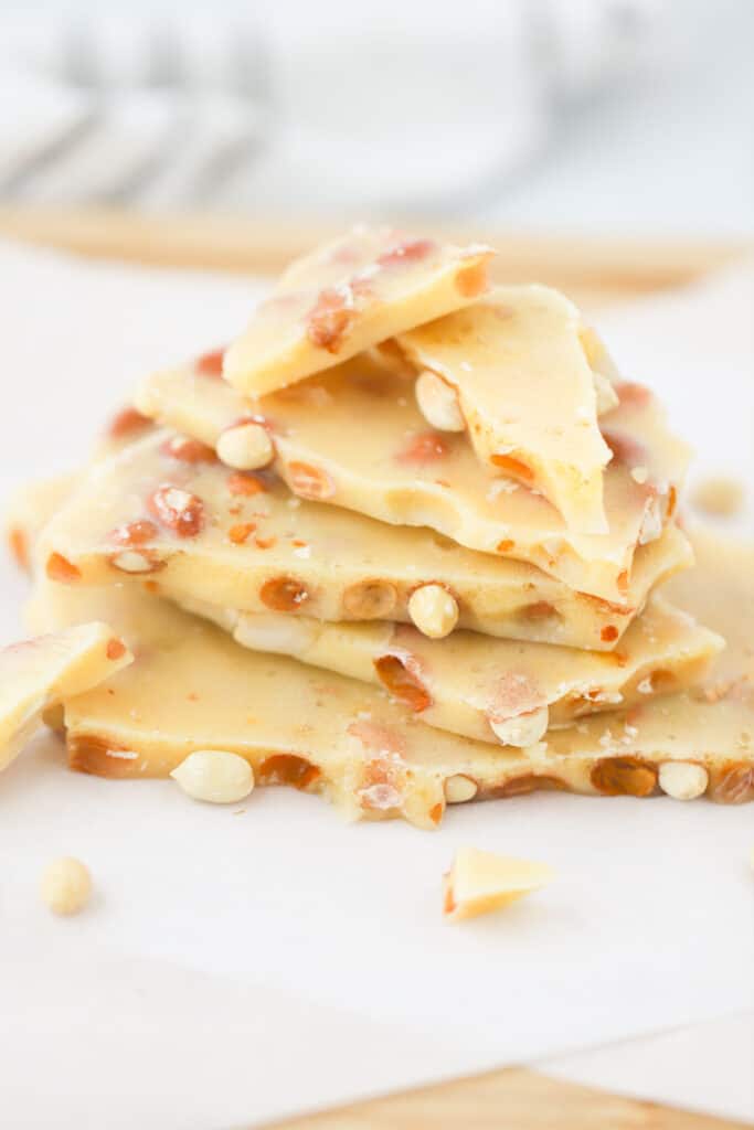 old-fashioned peanut brittle recipe, stacked on top of each other on a baking sheet.