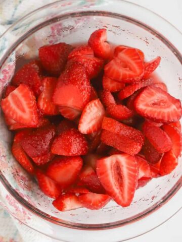 macerated strawberries in a small glass dish