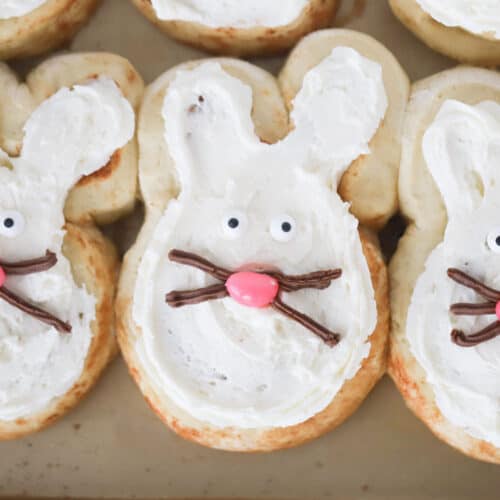 bunny cinnamon rolls on a baking sheet.