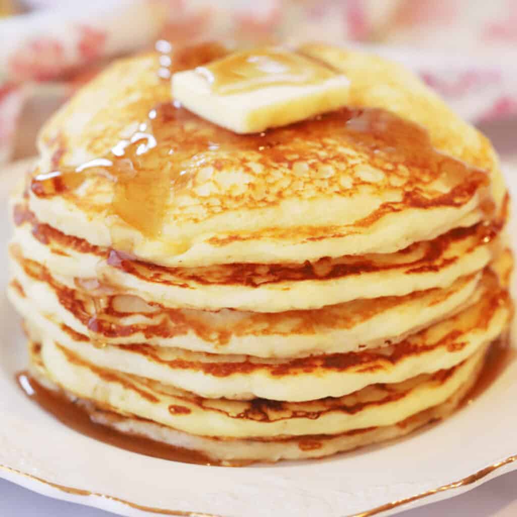 thick pancake recipe stacked on a plate with syrup and butter on top. Buttermilk pancakes from scratch. Pancake mix from scratch. Buttermilk.pancake recipe.