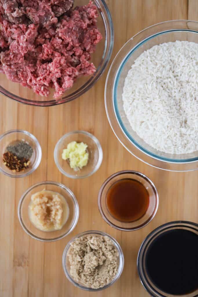 Ingredients for making Asian-inspired ground beef in separate ramekins on a table. how to make korean beef recipe. Meal with ground beef and rice.