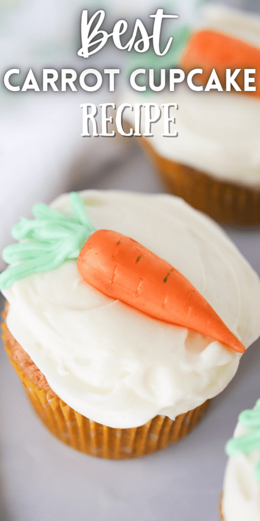 carrot cake cupcakes with a candy carrot on top.