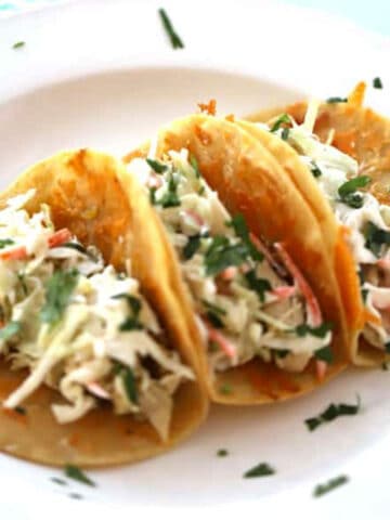 crockpot Cilantro Lime Chicken tacos are delicious on taco tuesday and the other 6 days of the week we wish were taco Tuesday! So delicious!