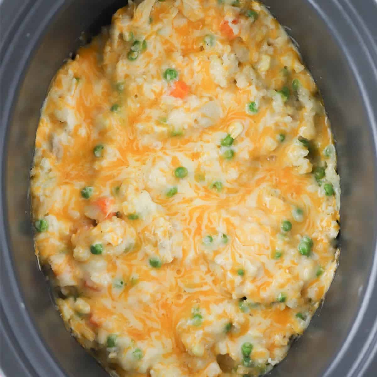 chicken and rice crockpot, crock pot cheesy chicken and rice, chicken and rice in crock pot.