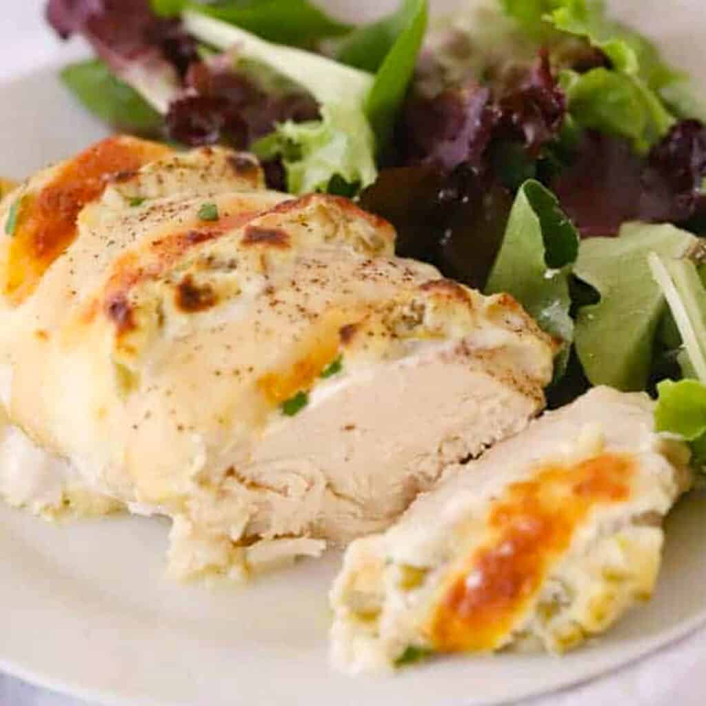 green chile hasselback chicken recipe on a plate, an easy baked chicken recipe, green chile chicken recipe.
