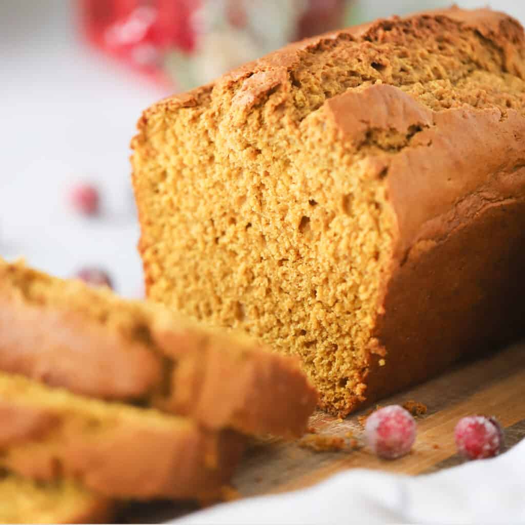 moist pumpkin bread on a cutting board.