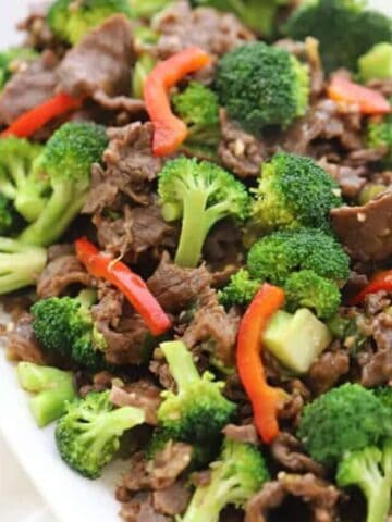 Homemade Teriyaki marinade for easy teriyaki beef and broccoli stir fry on a white plate served with rice, recipes with carne picada, beef teriyaki recipe.