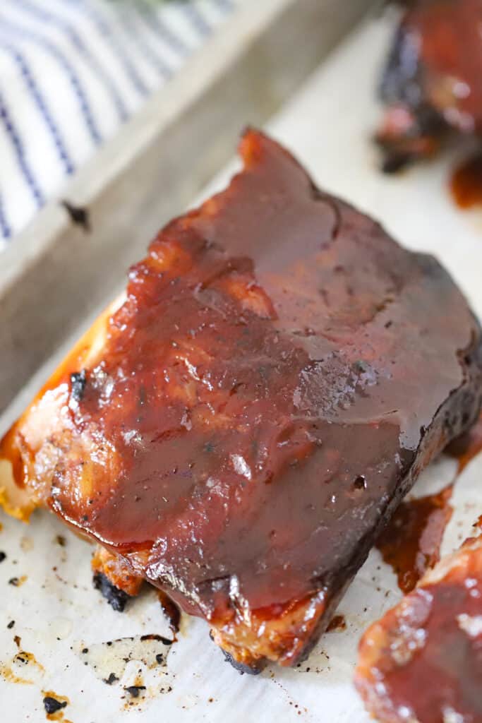 BBQ ribs on a sheet tray. pork spare ribs slow cooker, slow cooker spare ribs recipe, spare ribs recipe slow cooker