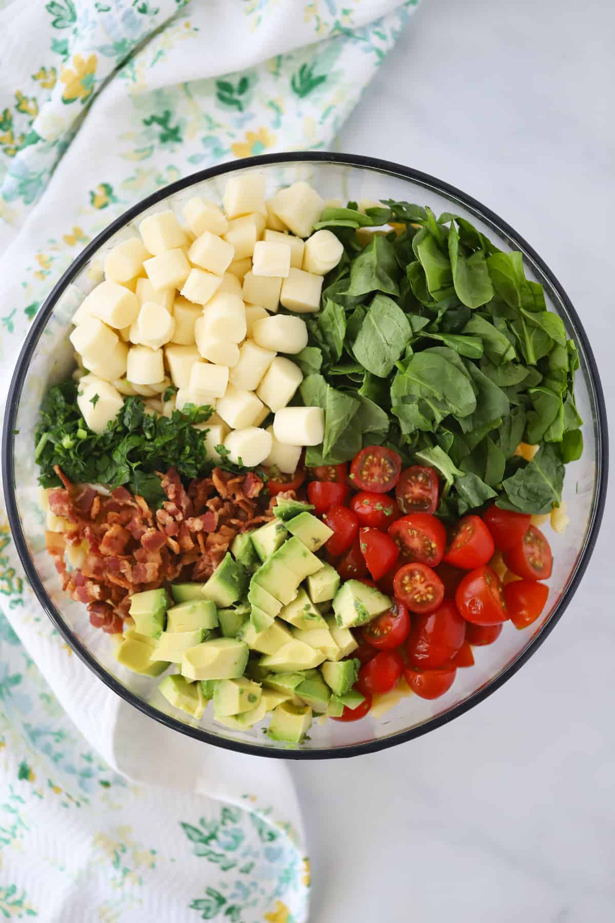Ingredients to make this BLT Pasta Salad Recipe in a large bowl.