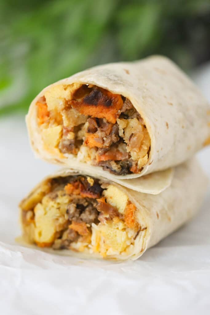 Two halves of a Breakfast Burrito stacked on top of each other.