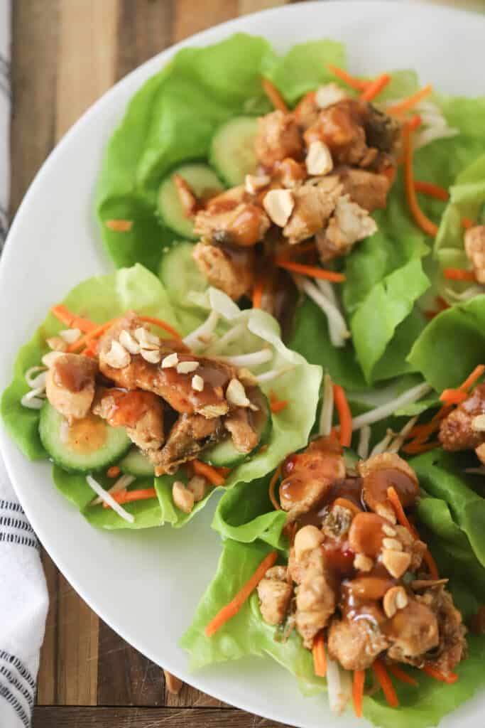 A platter with Thai chicken lettuce wrap recipe. 