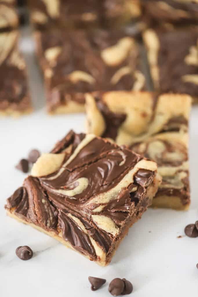 Chocolate Chip cookie bars cut into squares on a counter top. chocolate swirl cookie. 