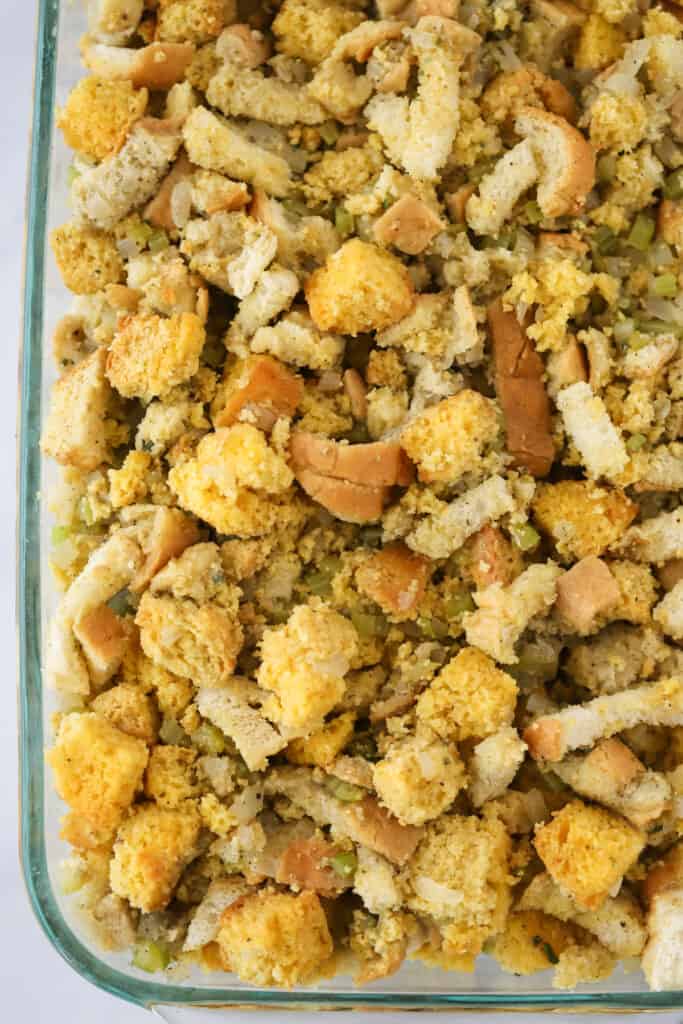 A baking pan full of the best Cornbread stuffing recipe ready to bake. This is a southern cornbread stuffing recipe made with both cornbread and French bread.