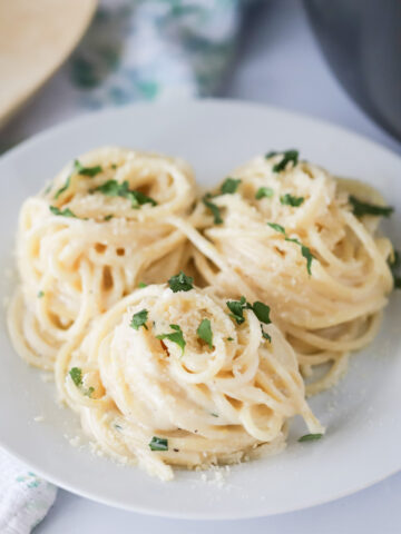 lemon cream sauce recipe on a white plate, garlic cream sauce for pasta, garlic cream sauce.