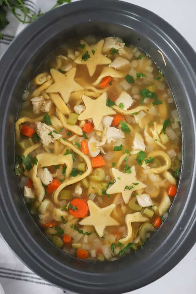 Chicken  Noodle Soup in a slow cooker with star shaped noodles. chicken noodle soup recipe slow cooker. crockpot chicken noodle soup recipes. 