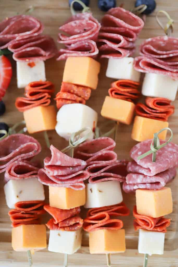 Skewers of sliced salami, pepperoni, and cheese.