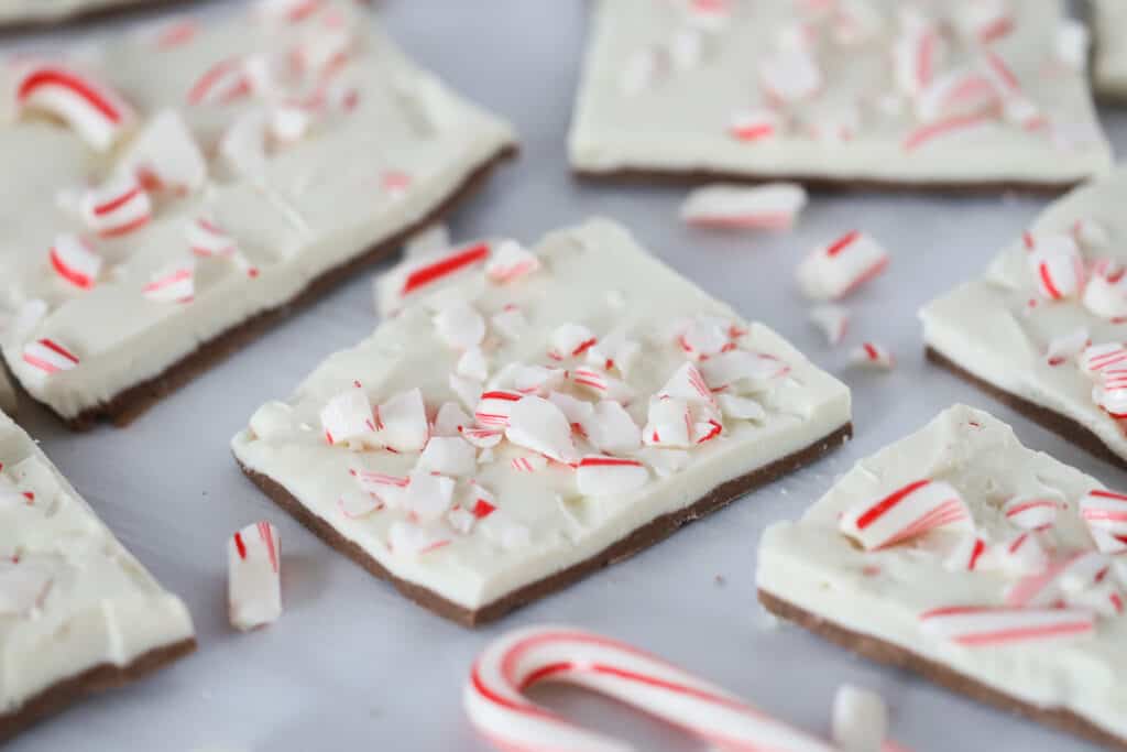 Peppermint bark squares topped with crushed candy canes. white chocolate peppermint bark, best peppermint bark recipe. 