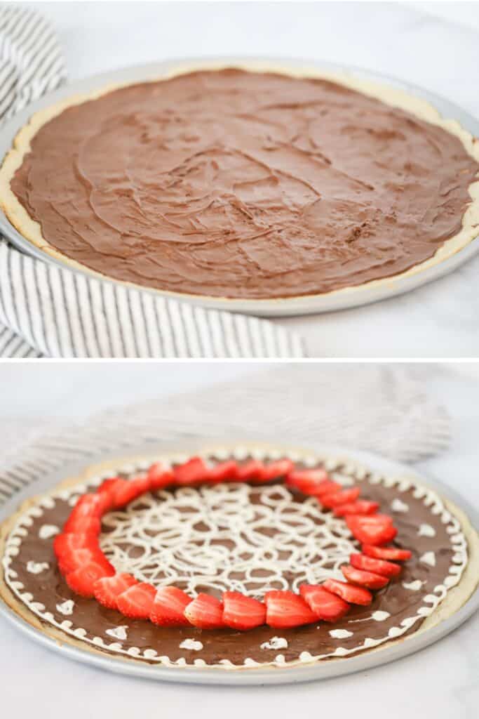 A pizza pan with a round cookie crust spread with Nutella, then topped with a ring of sliced strawberries and drizzled with white chocolate. nutella pizza dessert. 