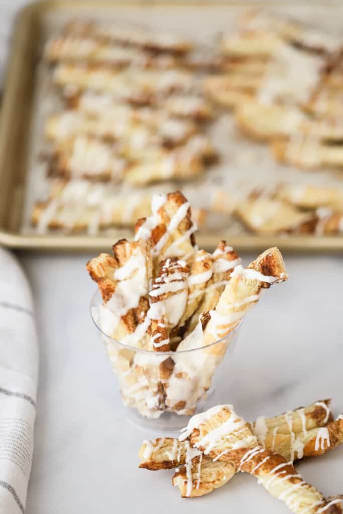 how to make puff pastry cinnamon twists, drizzled with vanilla icing.