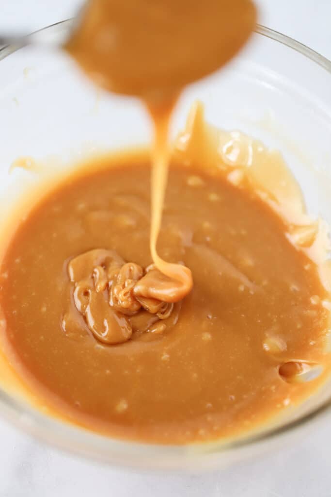 A bowl full of melted caramel.