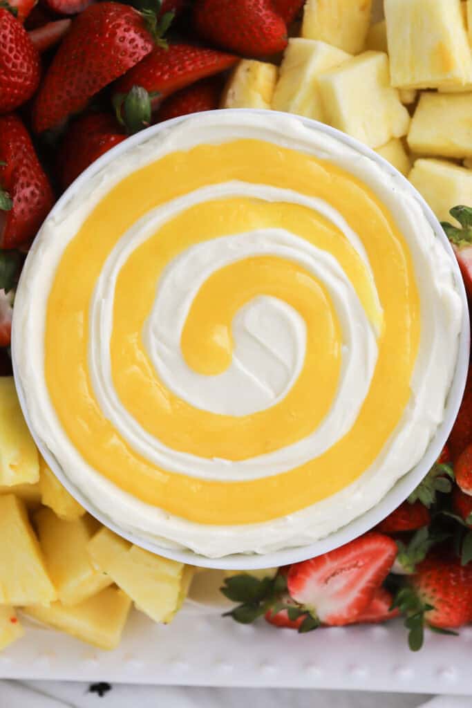 how to make a lemon cheesecake fruit dip with lemon curd swirl.