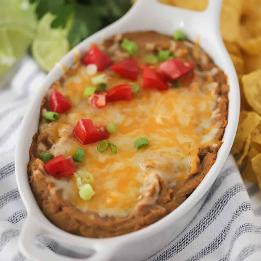 refried beans topped with cheese, one of the best party foods.