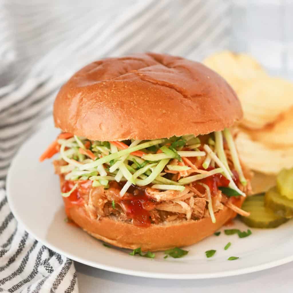 easy to make Tangy Crockpot Chicken Sliders recipe made in a slow cooker. 