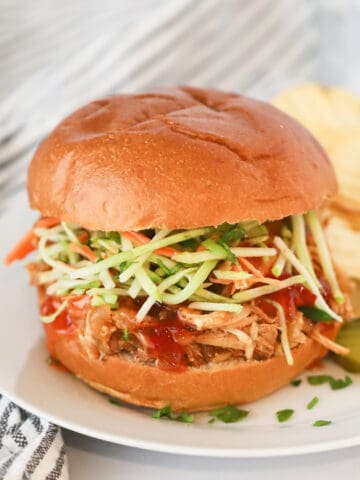 easy to make Tangy Chicken Sliders recipe made in a slow cooker.
