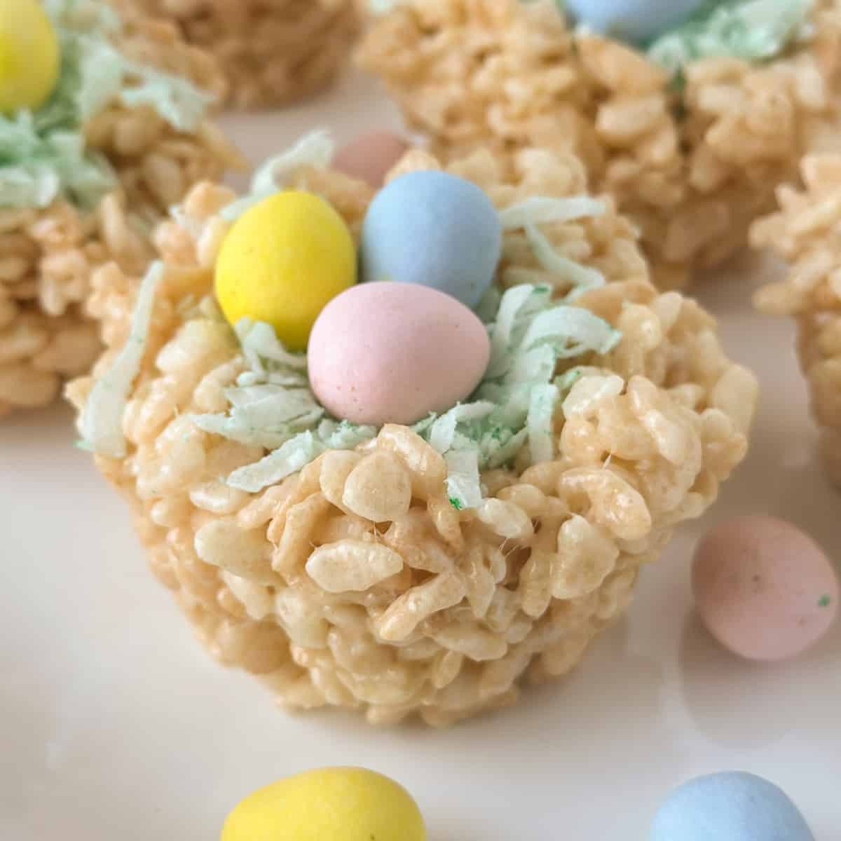 rice krispy treats easter, Rice Krispies treat decorated to look like a birds nest, with three chocolate eggs on top. rice krispies nests