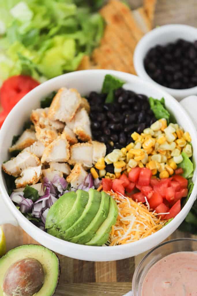 A bowl full of ingredients in this Southwest Chicken Salad recipe. Breaded chicken salad, fried chicken salad, crispy chicken salads.