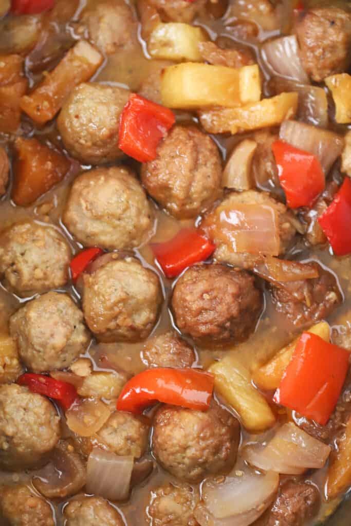 Sweet and sour crockpot meatballs with peppers and pineapples.
