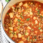 vegetable beef soup recipe in a white pot, vegetable soup with ground beef, recipe vegetable beef soup.