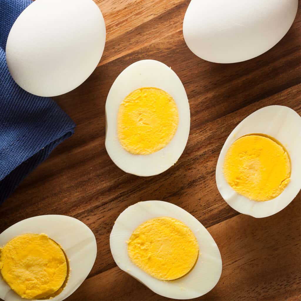 hard boiled eggs on a cutting board