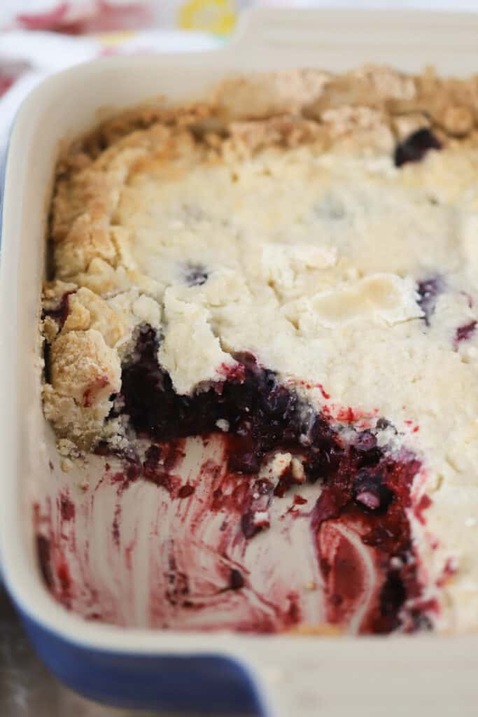 Triple Berry Cobbler with cake mix topping in a baking dish. Easy Berry Cobbler, blackberry cobbler cake mix, frozen berry cobbler. Blackberry cobbler with cake mix, blackberry cobbler cake mix.