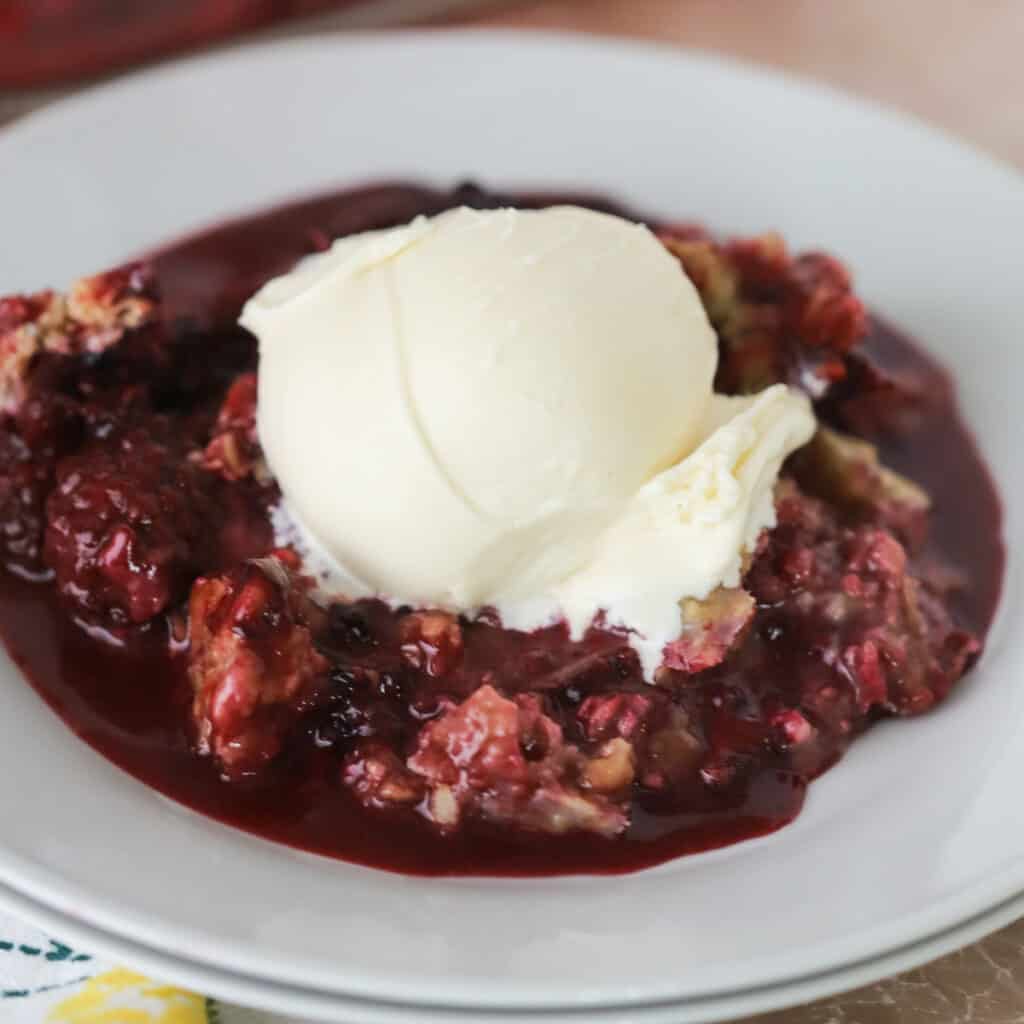 Blackberry pie with vanilla ice cream is a great memorial day dessert menu idea.