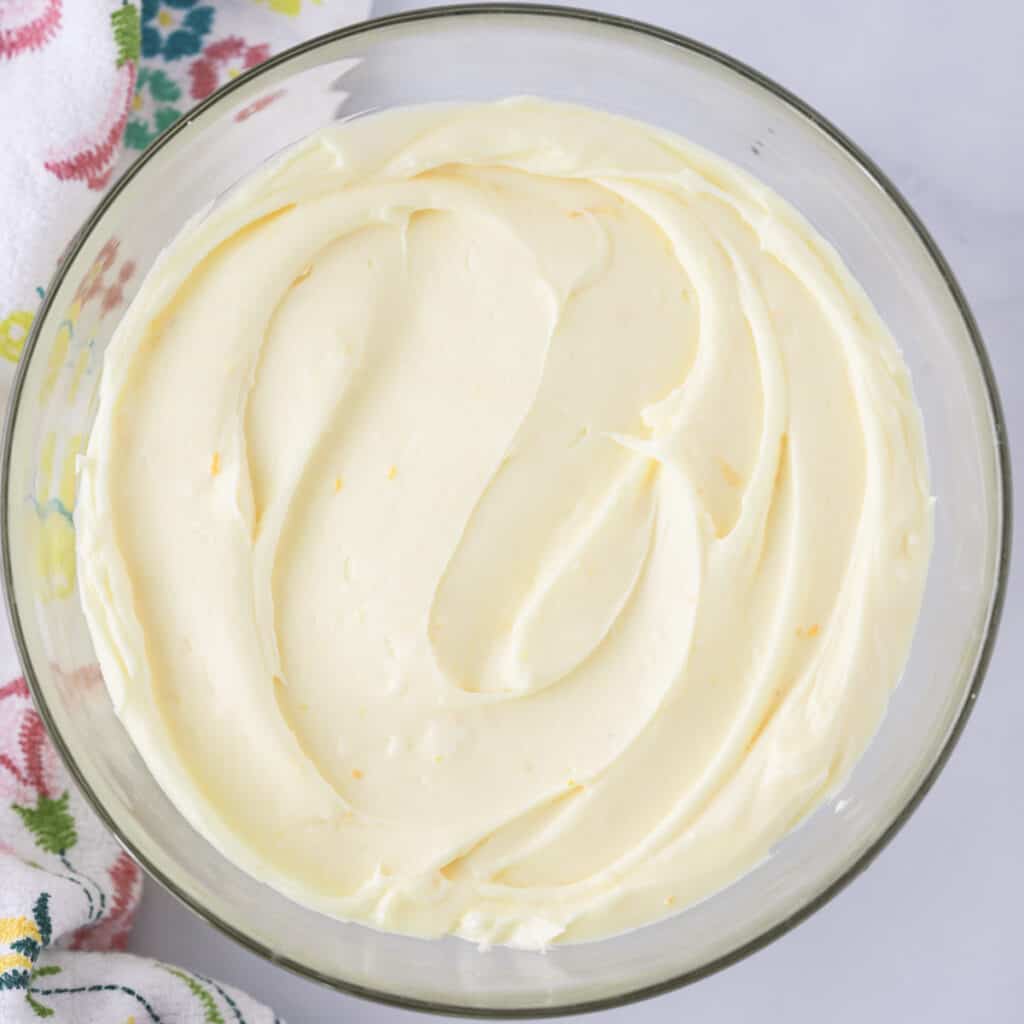 how to make the best lemon cream cheese frosting recipe. Lemon Cream Cheese Frosting in a glass bowl