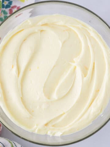 how to make the best lemon cream cheese frosting recipe. Lemon Cream Cheese Frosting in a glass bowl
