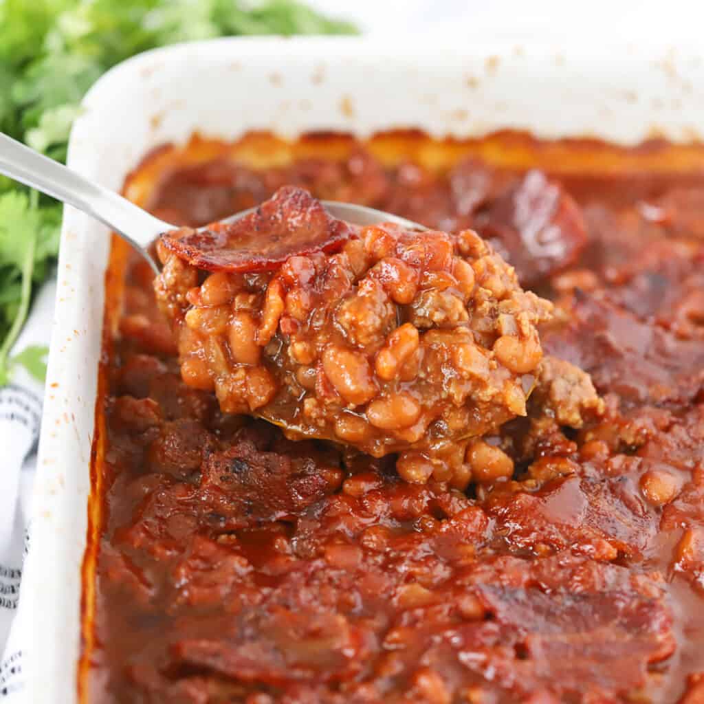 baked beans recipe in a baking dish, a classic memorial day recipe.