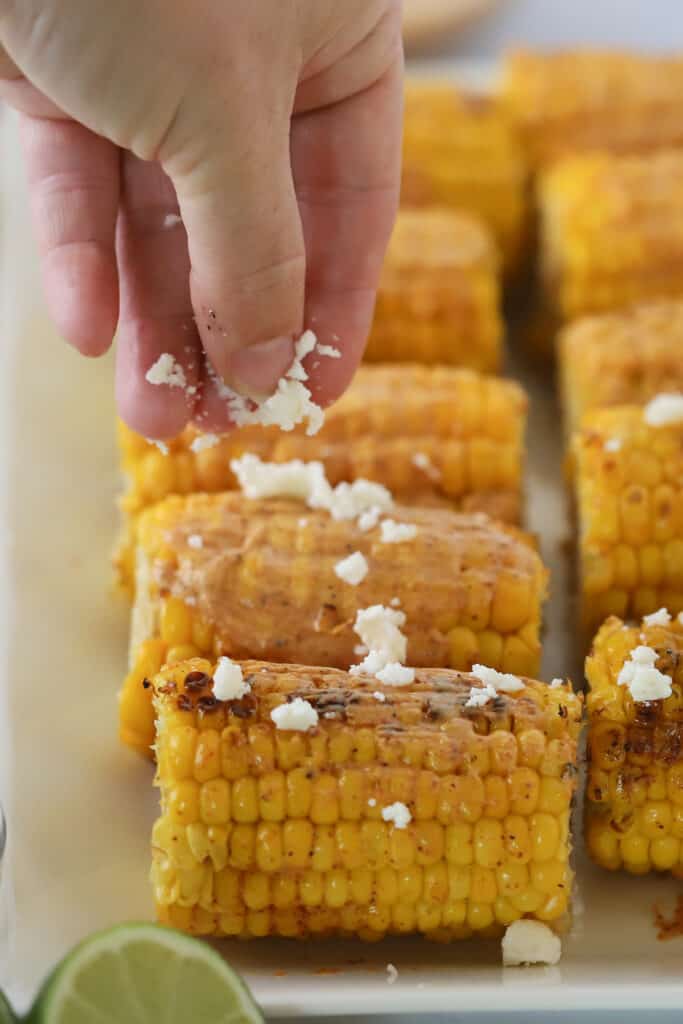 Grilled Mexican Street Corn Recipe topped with cotija cheese; best grilled street corn recipe. Mexican corn on the cob grilled.