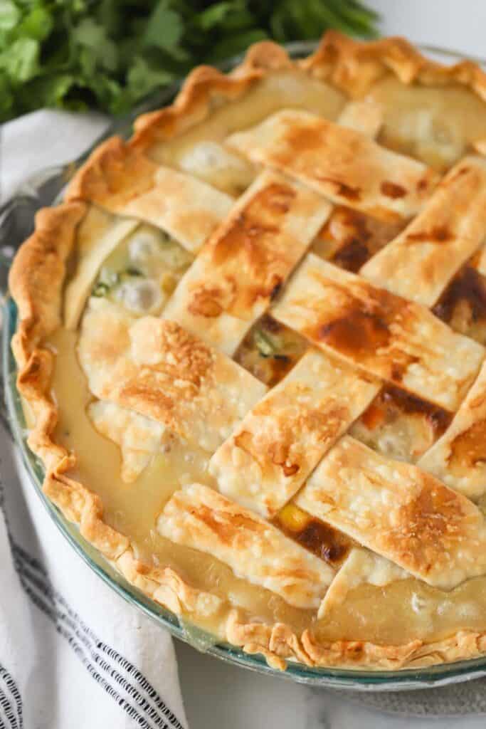 Golden brown double crust chicken pot pie with a flaky crust. How to make this chicken pot pie recipe from scratch.