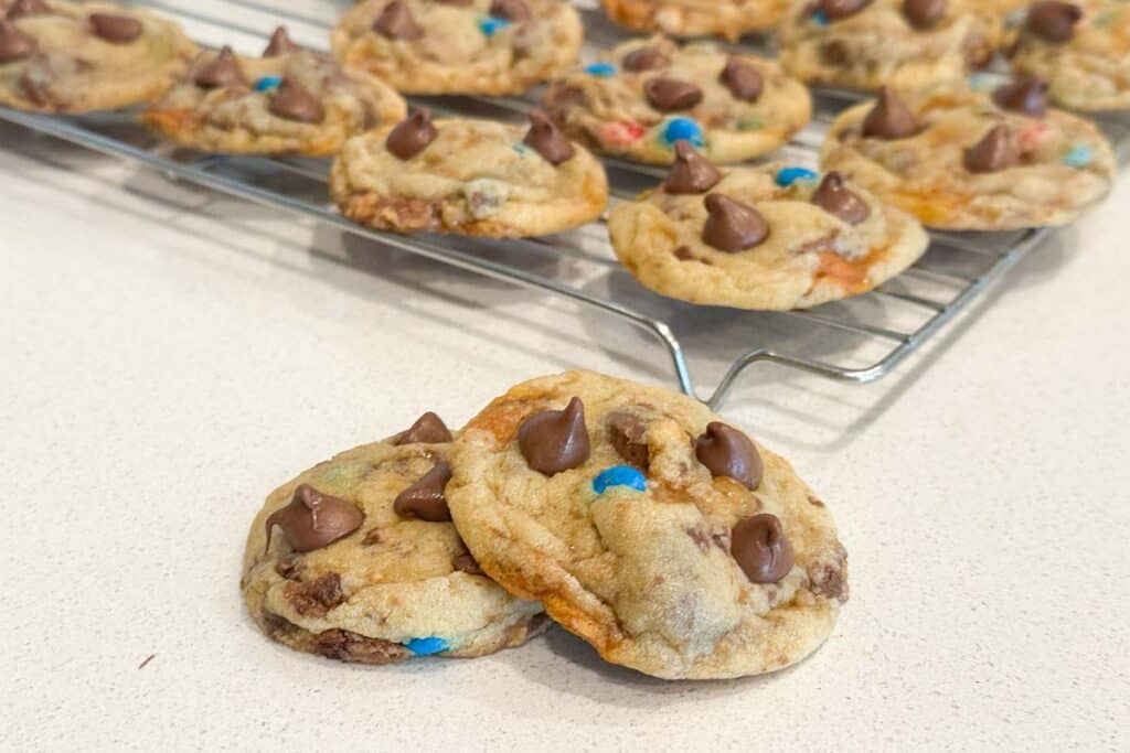 These candy bar cookies are the perfect combination of cookies and candy, made with chocolate chip cookies and leftover halloween candy.