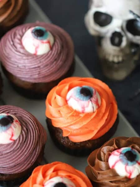 Cyclops cupcakes on a tray decorated for halloween