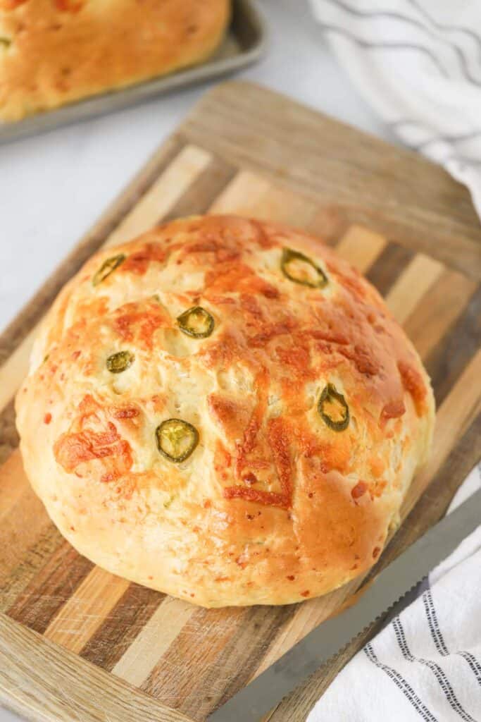 Recipe for jalapeno cheddar bread, an easy jalapeno bread recipe on a cutting board.