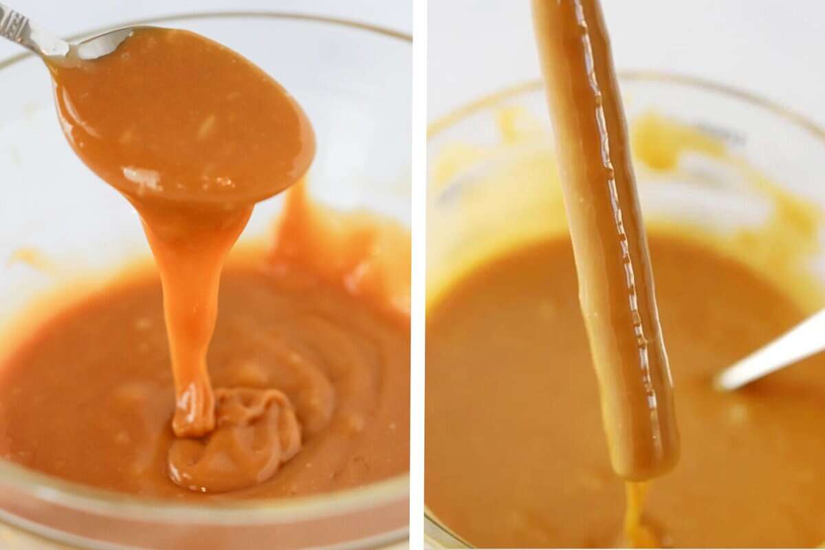 pretzel rod being dipped in a large bowl of caramel sauce.
