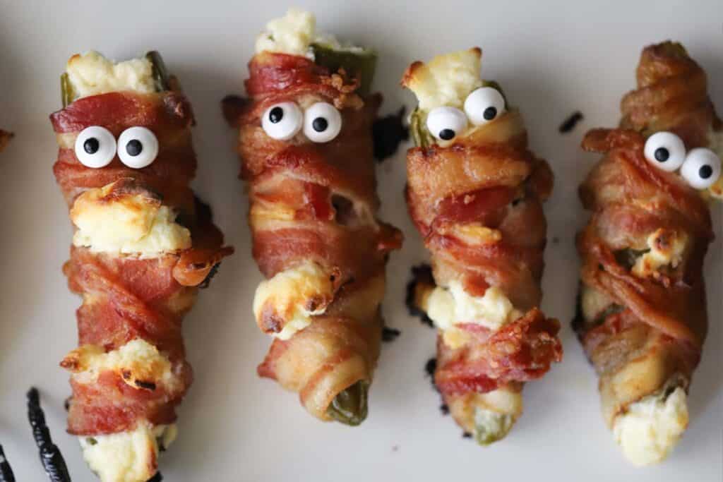 halloween mummy jalapeno poppers, mummy poppers, easy halloween appetizers.